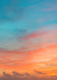 Fototapeta Zachód słońca - Pastel colors ocean sunset, warm and cyan clouds sky heaven