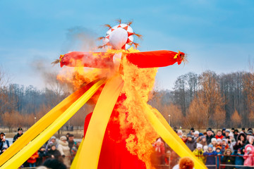 Wall Mural - Burning Effigies Straw Maslenitsa In Fire On The Traditional National Holiday Dedicated To The Approach Of Spring - Slavic Celebration Shrovetide.