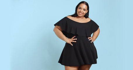 Plus size model in studio shoot happy smiling