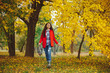 © arthurhidden - Girl with long wavy hair enjoying autumn in the park.