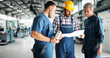 © NDABCREATIVITY - Supplier with engineer checking on production in factory