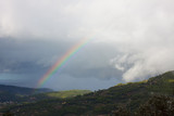 Fototapeta Tęcza - Rainbow over Soller Valley surrounded by the Serra de Tramuntana mountains. Majorca, Spain