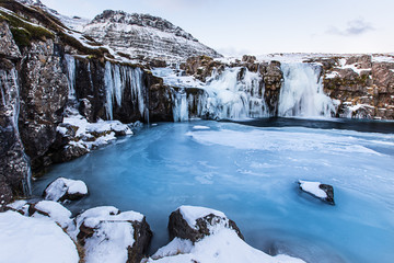 Wall Mural - Kirkjufell waterfall with mountain in winter, Iceland