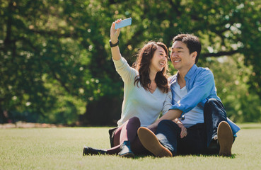 Wall Mural - Middle age couple spending time together in Tokyo on a sunny autumn day