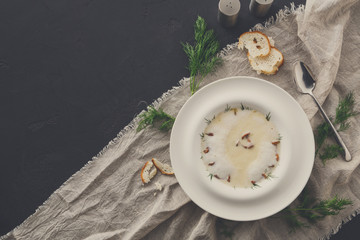 Wall Mural - Delicious cream soup with honey fungus top view