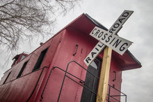 Railroad Crossing. Railroad Crossing Sign With Historical Red Caboose.