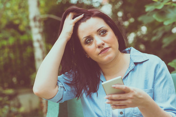  Portrait of young woman using her mobile phone