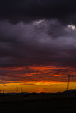 Fototapeta Do pokoju - Sunset clouds and electric pylon
