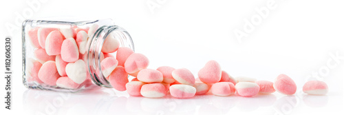 Plakat colorful candies in glass jars on white background - Web banner with food concept
