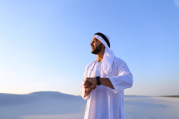 Wall Mural - Portrait of handsome Arab businessman who experiencing new iWatc