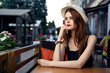 © SHOTPRIME STUDIO - beautiful girl in a hat sits in a cafe waiting for her prince