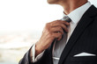 © Jacob Lund - Businessman adjusting his look