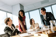 © Jacob Lund - Diverse business people smiling during a meeting