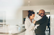 © Jacob Lund - Smiling young family in kitchen