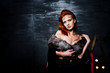 © AS Photo Family - Fashion model red haired girl with originally make up like leopard predator against steel wall. Studio portrait on ladder.
