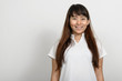 © Ranta Images - Portrait of beautiful Asian woman against white background