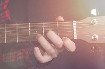  Musician Playing accord Dm on acoustic guitar, close up