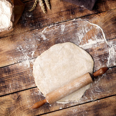 Wall Mural - Roll out dough with rolling pin and flour