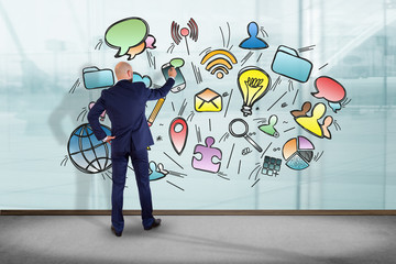 Poster - businessman in front of a wall drawing application multimedia internet - internet concept