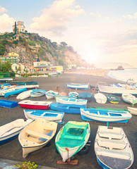 Wall Mural - boats on beach at sunset in small fishing village