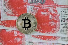 Silver Bitcoin On Hongkong Dollar Banknote Background