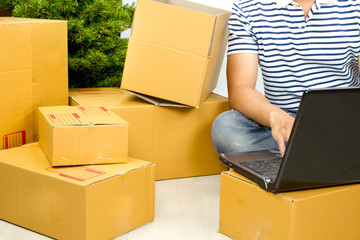 Man starter business with online eCommerce prepare many carton box to shipping to his customer