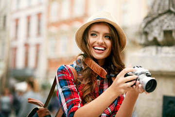 Tourist Woman With Camera Taking Photos Of Beautiful Location