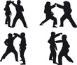 silhouettes of children karatek perform sparring on kumite
