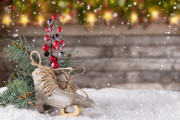 Christmas decoration ice skates on wooden background