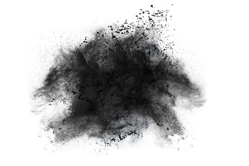 Black powder explosion against white background.The particles of charcoal splatted on white background. Closeup of black dust particles explode isolated on white background.