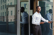 © Prostock-studio - Portrait of a confident young black businessman with papers