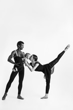 A Happy Family Of Ballet Dancers On White Studio Background