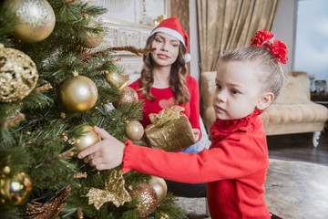 Wall Mural - Christmas mother and daughter with Christmas tree