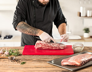 Poster - Man cooking meat steak on kitchen