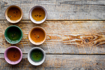 Tea break. Cookware fo tea ceremony. Cups on rustic wooden background top view copyspace