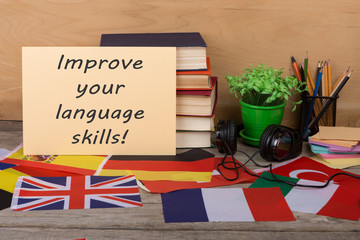 Fototapete - Learning languages concept - paper with text 