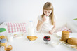 © Nichizhenova Elena - Girl having breakfast