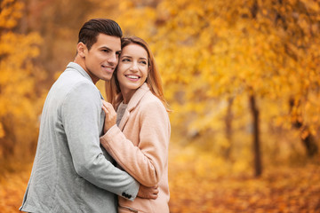 Sticker - Young couple in park on autumn day