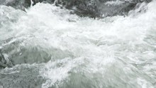 Close Up And Slow Motion On High White Water River Rapids.