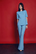 © EVGENY FREEONE - Woman in flared blue trousers