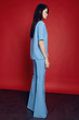 © EVGENY FREEONE - Woman in flared blue trousers
