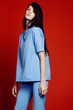 © EVGENY FREEONE - Woman in flared blue trousers