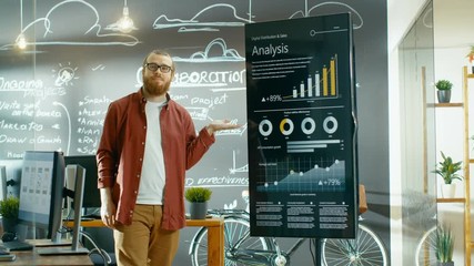 Poster - Male Developer Looks at Interactive Whiteboard with Mock-up Green Screen. He Points at Display with Presenting Gesture and a Smile. Shot on RED EPIC-W 8K Helium Cinema Camera.