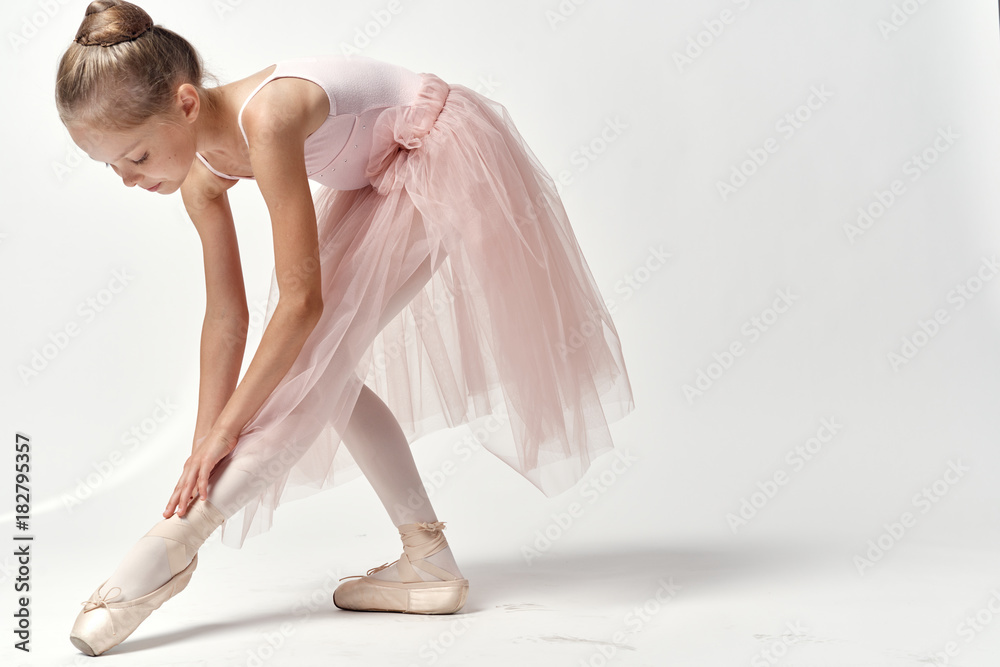 ballet dancer corrects pointes - obrazy, fototapety, plakaty 