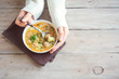 © mizina - Meatball soup in hands