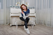 © AS Photo Family - Girl wear warm sweater background piano with candles on studio. Happy new year winter holidays concept.