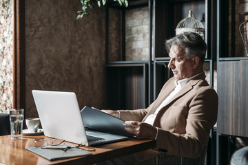 Wall Mural - Businessman Doing Paperwork