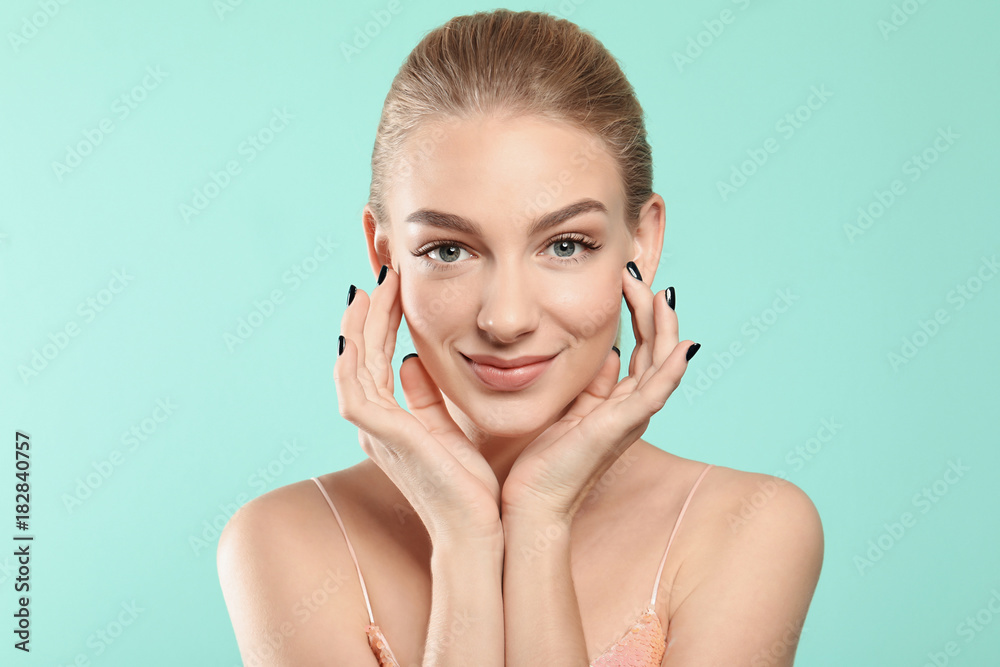 Beautiful woman with long eyelashes on color background