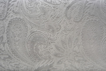 gray or silver velvet fabric with a vintage elegant floral pattern or a luxury texture.