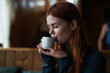 © SHOTPRIME STUDIO - Beautiful young woman drinks coffee in a cafe